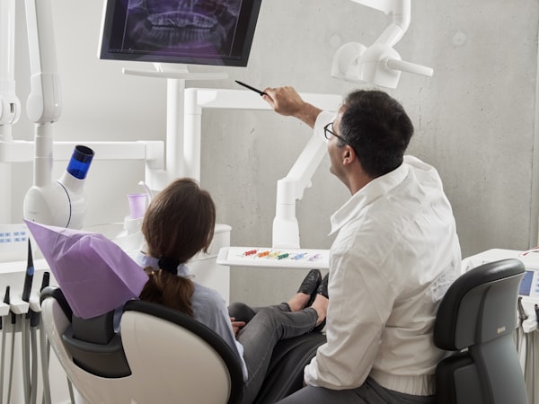 A dentist consulting with a patient at Advocate Healthcare